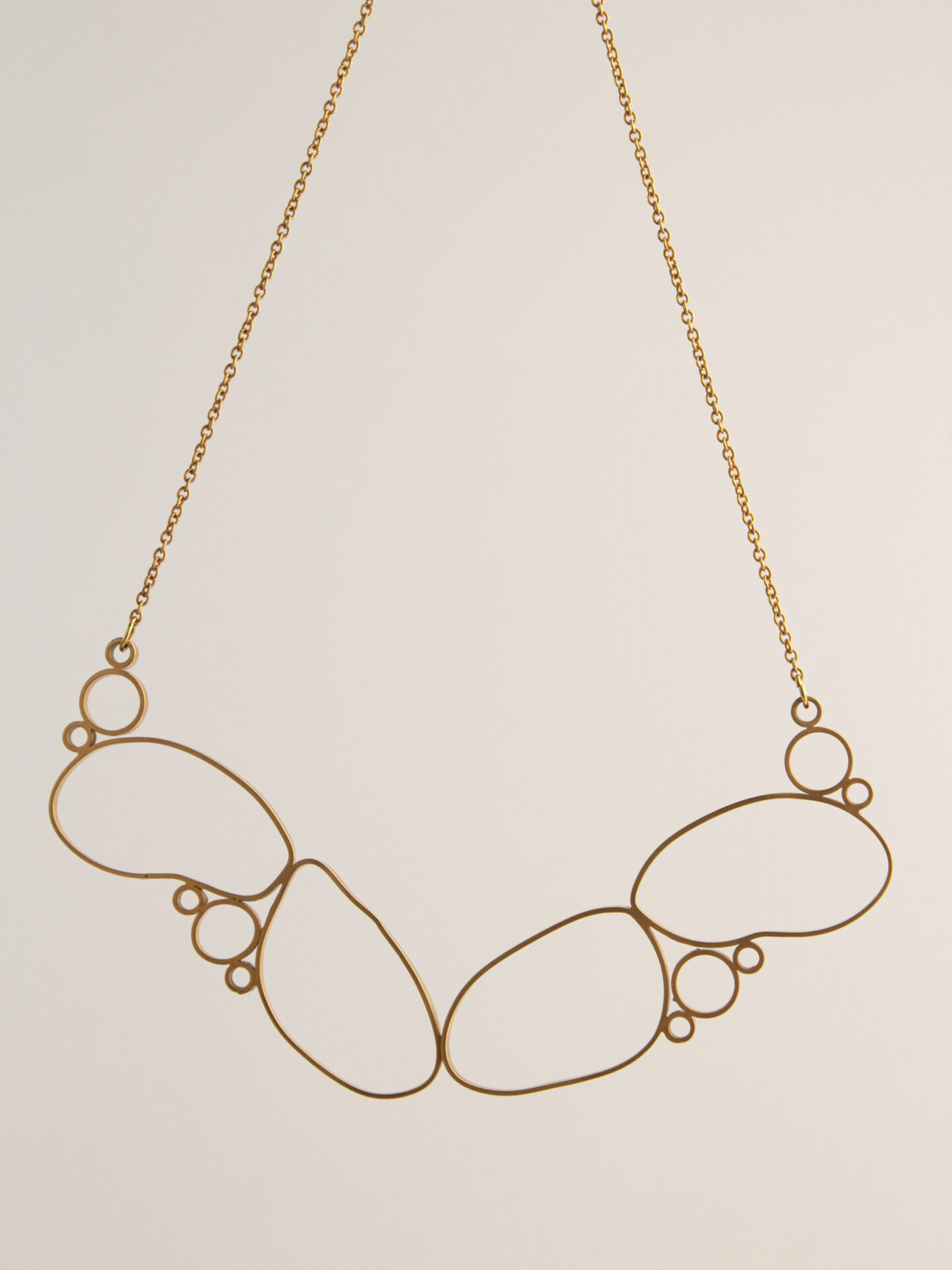 big fancy majestic gold-plated necklace.