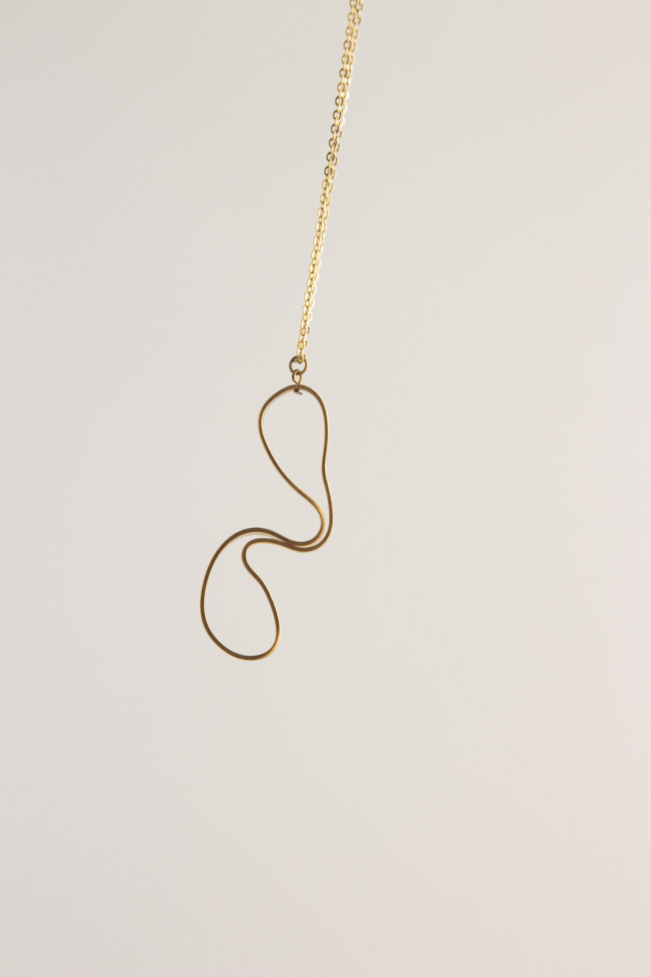 abstract shaped ornament 18K gold-plated necklace.