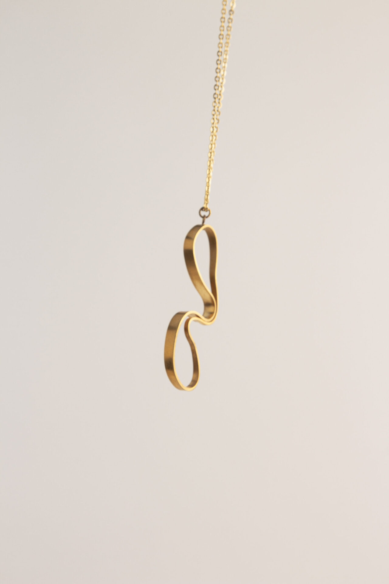 abstract shaped ornament 18K gold-plated necklace.