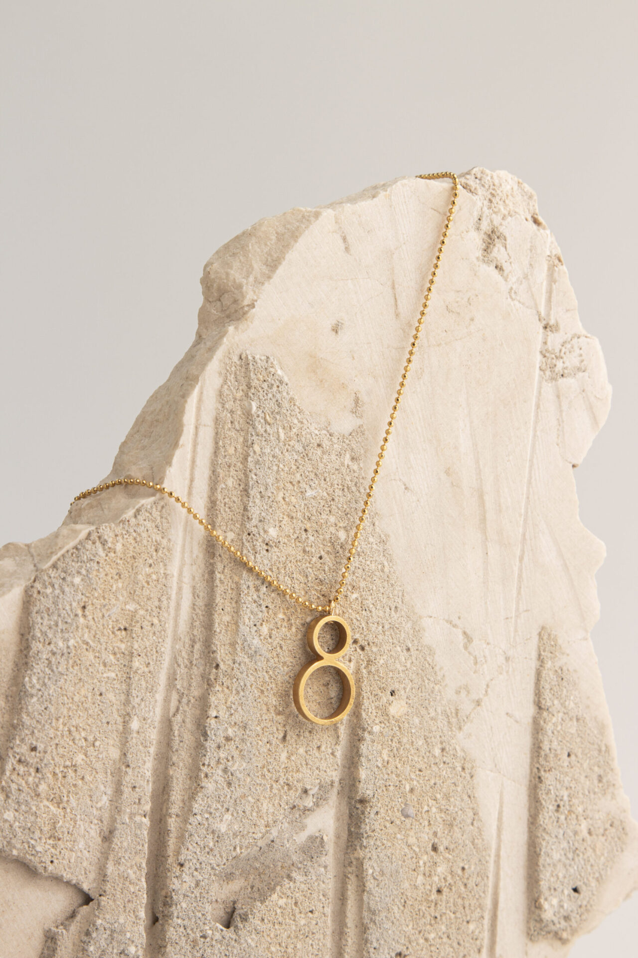 Gold-Plated necklace composed of miniature circles.