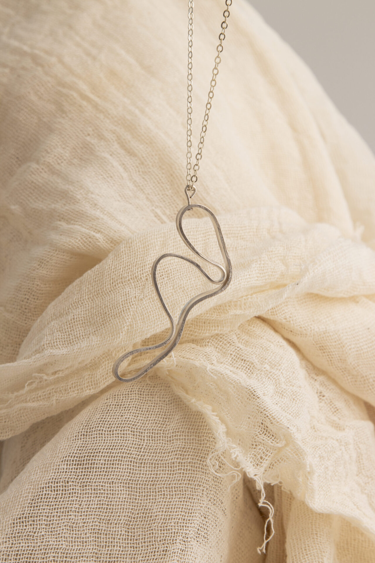 Abstract shaped ornament 18K gold-plated necklace.
