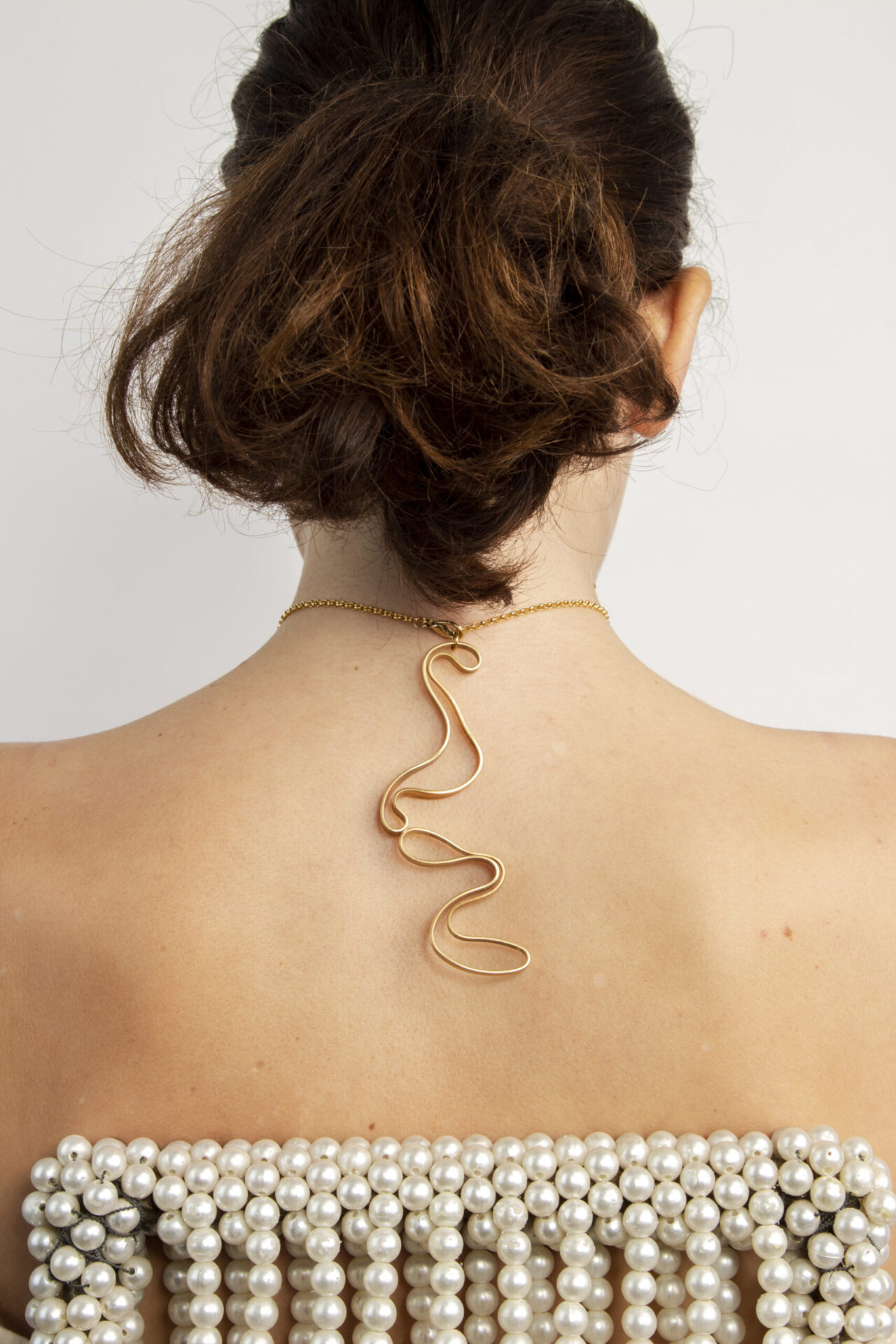 Abstract shaped ornament 18K gold-plated necklace.