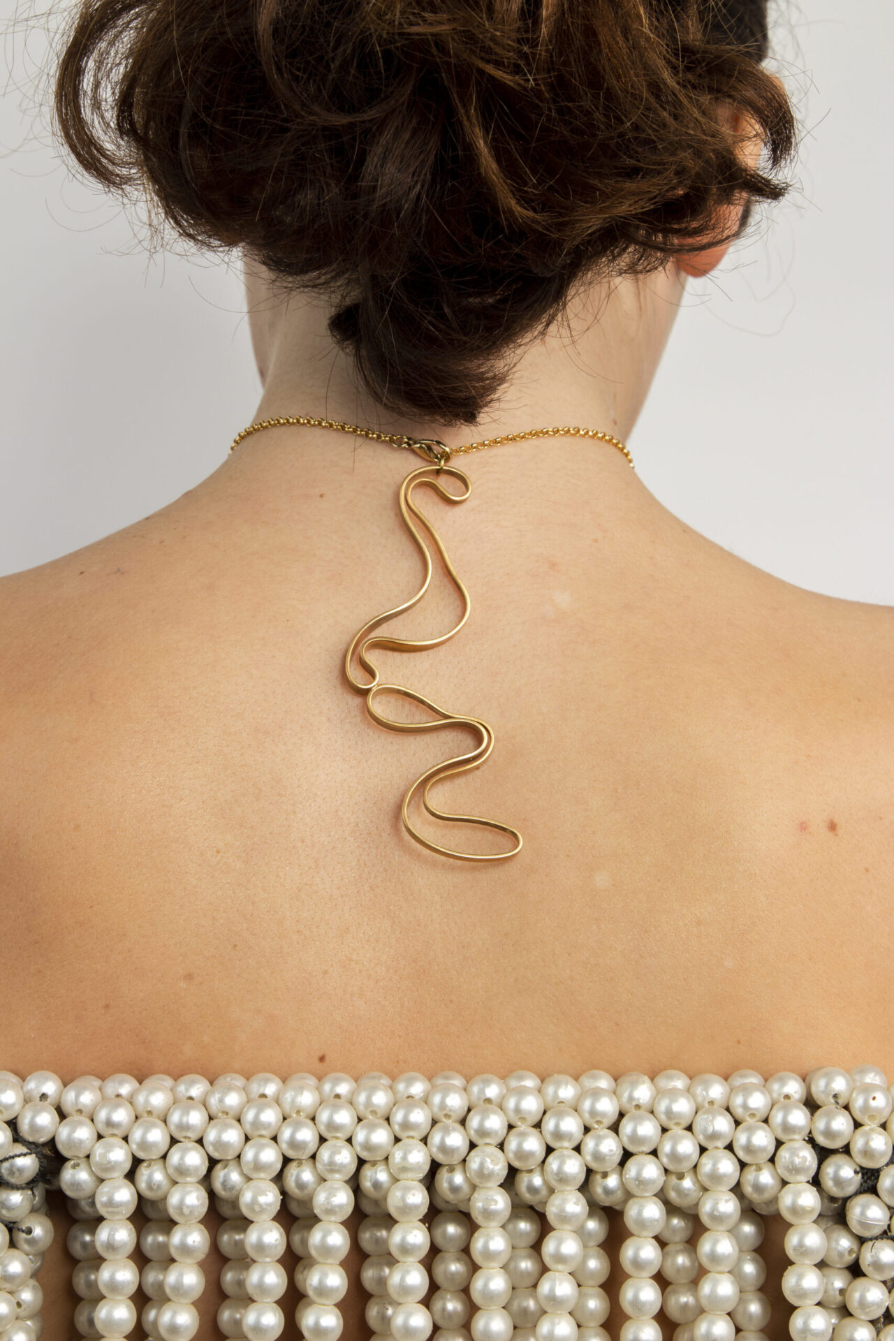 Abstract shaped ornament 18K gold-plated necklace.