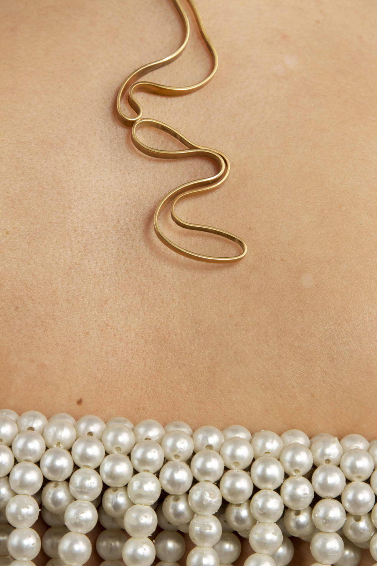 Abstract shaped ornament 18K gold-plated necklace.