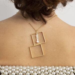 Gold-Plated squares necklace with a line of pearls.